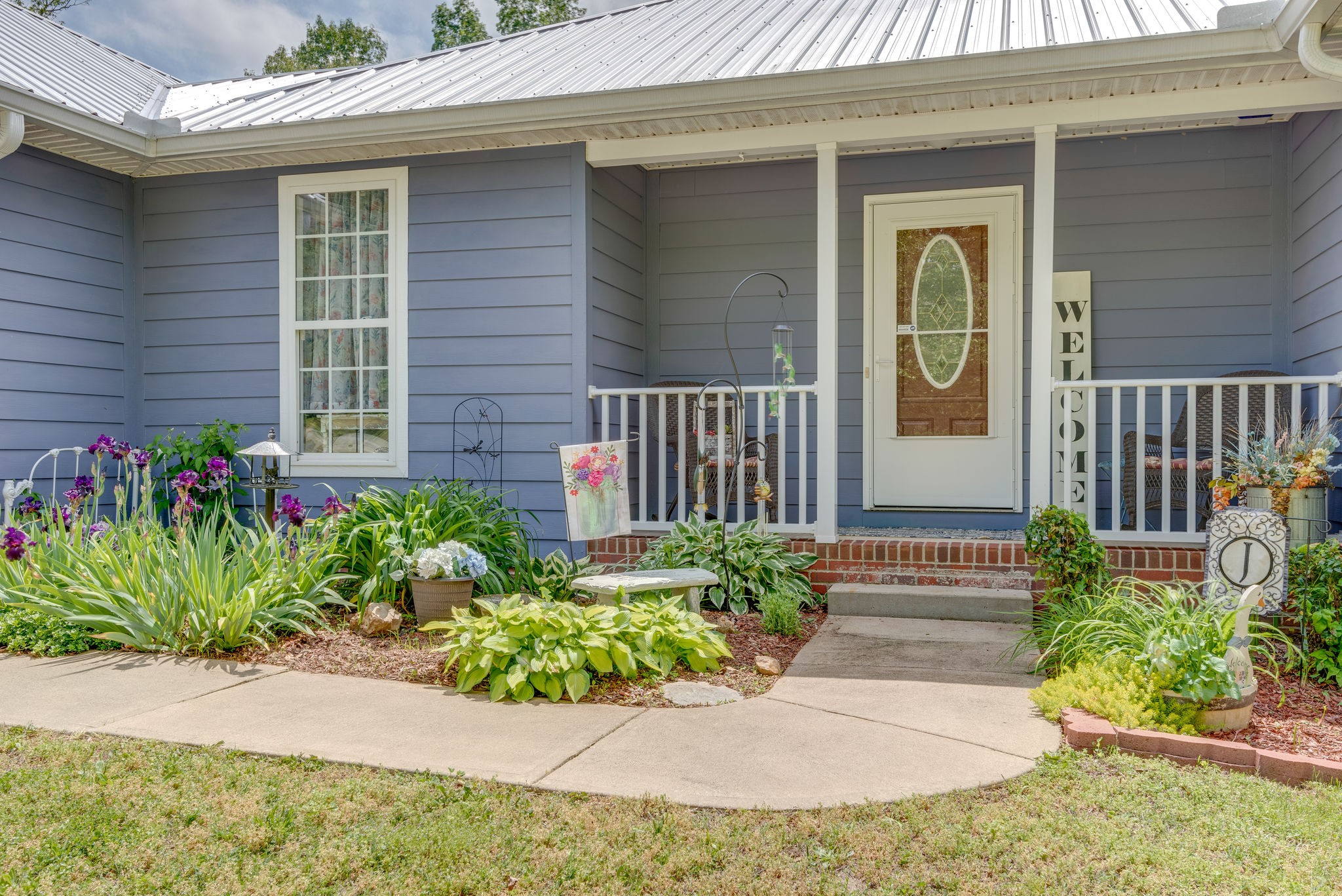 6826 Primm Springs Road Lyles, TN 37098 - Photo 4 of 28 a front view of a house having yard