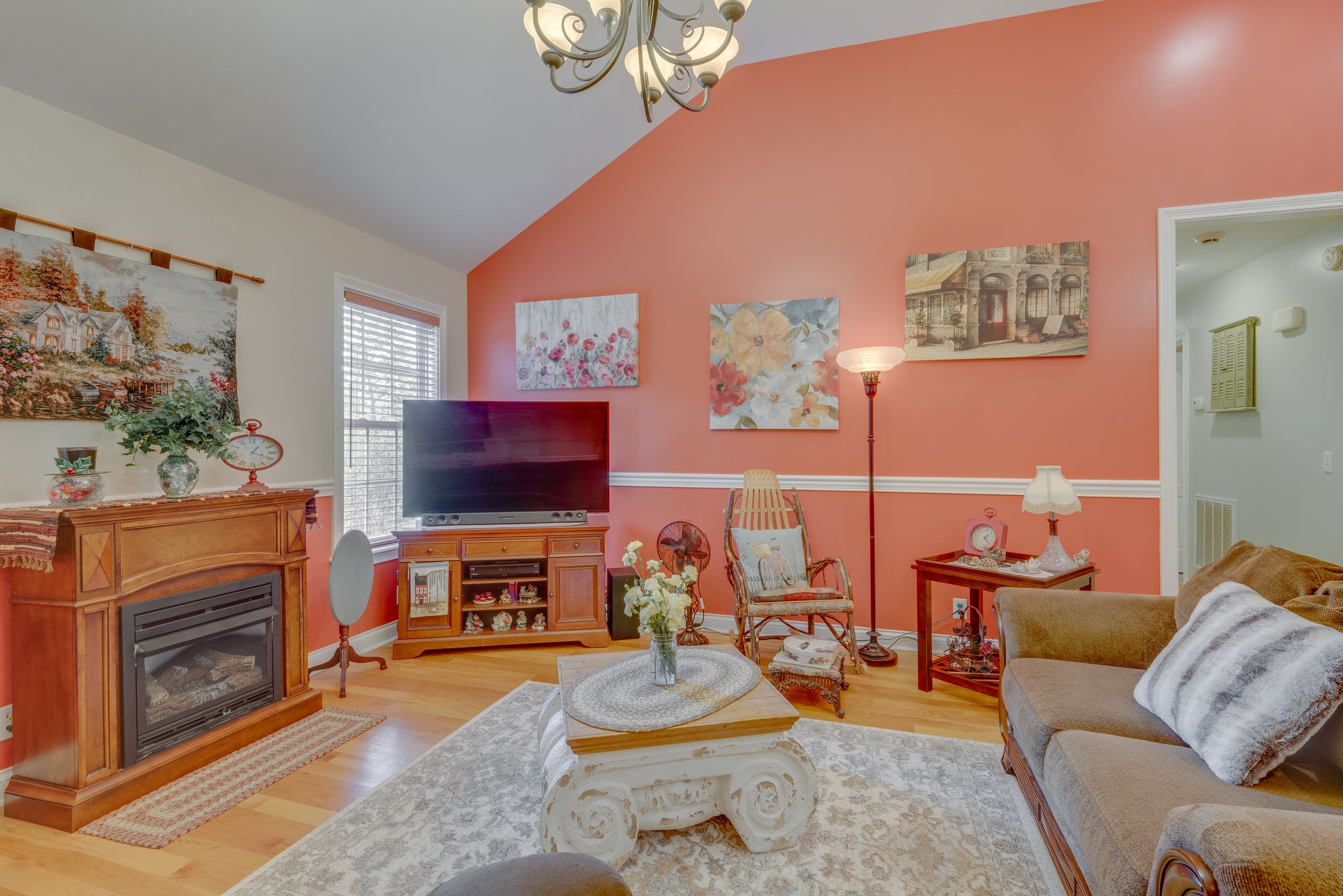 6826 Primm Springs Road Lyles, TN 37098 - Photo 8 of 28 a living room with furniture a flat screen tv and a fireplace