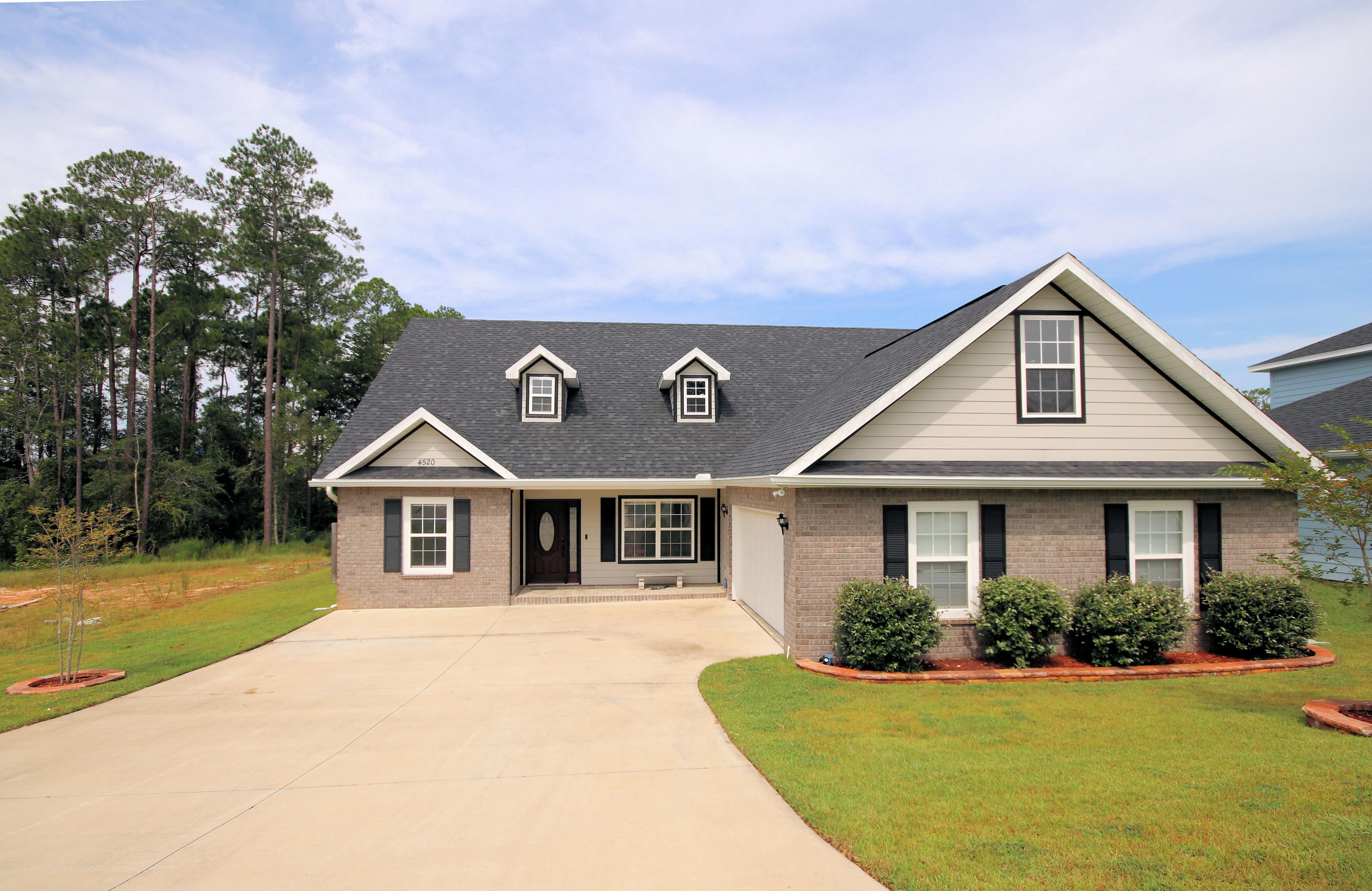 4520 Hermosa Road Crestview, FL 32536 - Photo 1 of 43 a front view of a house with a yard