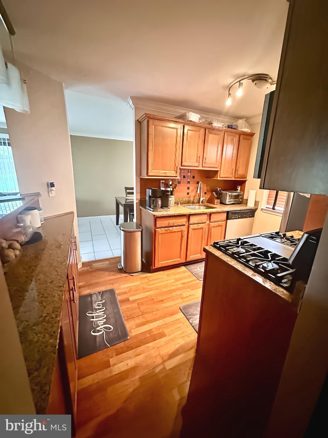 29 Gate House Lane Edison, NJ 08820 - Photo 13 of 35 a kitchen with stainless steel appliances granite countertop a stove a sink and a refrigerator