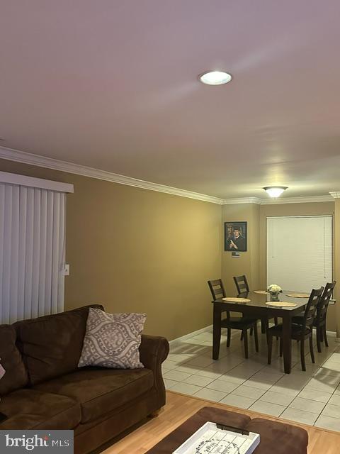 29 Gate House Lane Edison, NJ 08820 - Photo 18 of 35 a living room with furniture and a dining table with bookshelf