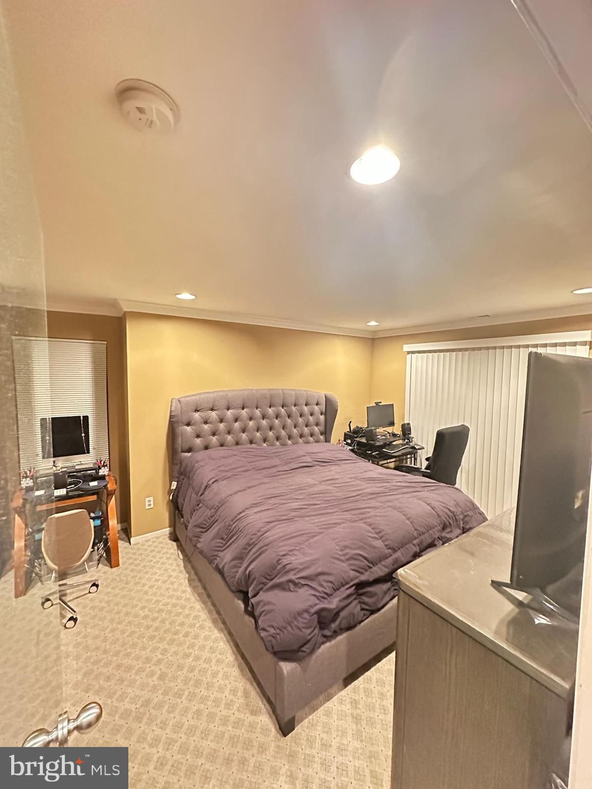 29 Gate House Lane Edison, NJ 08820 - Photo 19 of 35 a bed sitting in a room next to a window with pc on the table