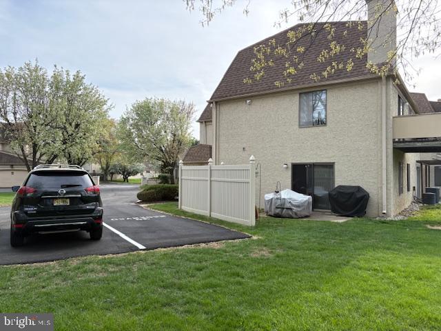 29 Gate House Lane Edison, NJ 08820 - Photo 26 of 35 a view of a car parked in the yard