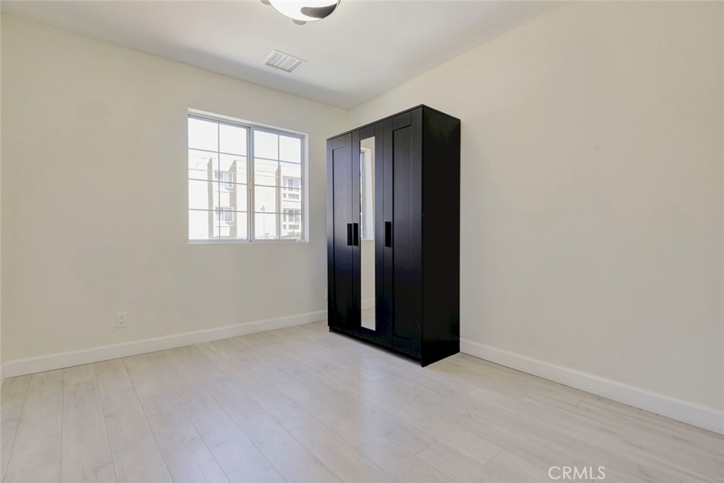 7044-1 Greeley Street Tujunga, CA 91042 - Photo 17 of 27 an empty room with windows and closet