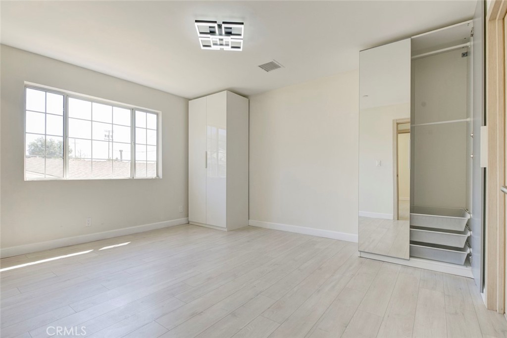 7044-1 Greeley Street Tujunga, CA 91042 - Photo 24 of 27 an empty room with windows