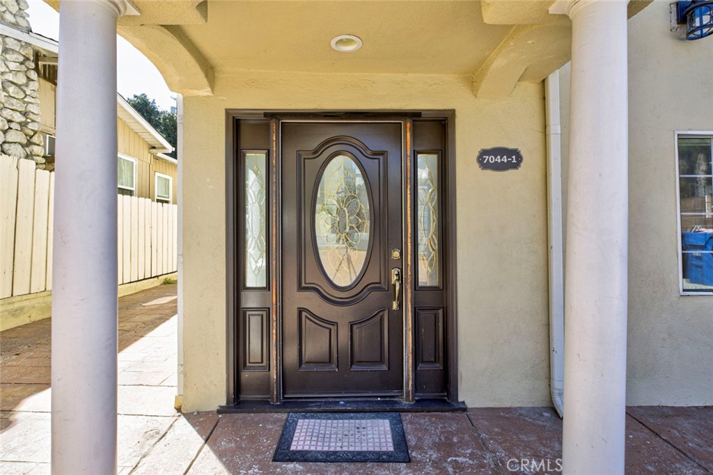 7044-1 Greeley Street Tujunga, CA 91042 - Photo 4 of 27 a front view of a house with garden