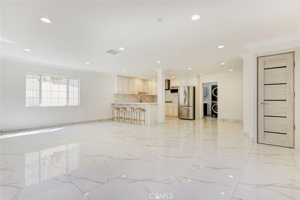7044-1 Greeley Street Tujunga, CA 91042 - Photo 7 of 27 a view of a kitchen with stainless steel appliances kitchen island granite countertop a refrigerator and a sink