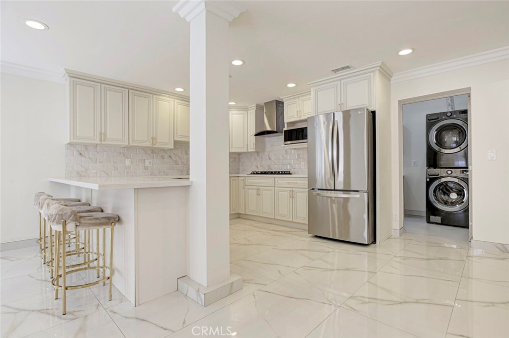 7044-1 Greeley Street Tujunga, CA 91042 - Photo 9 of 27 a kitchen with stainless steel appliances granite countertop a refrigerator and a stove