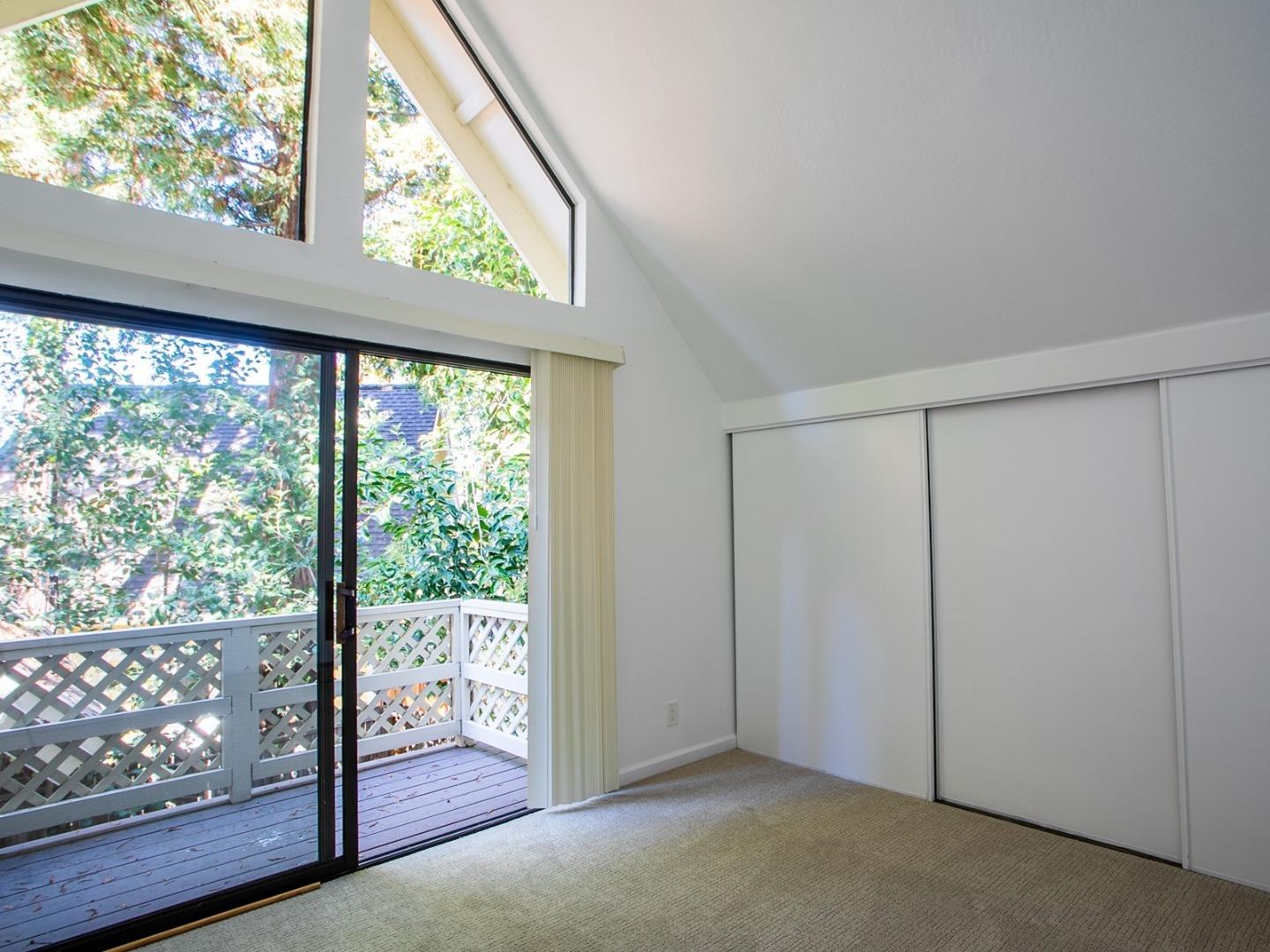 2536 West Middlefield Road Mountain View, CA 94043 - Photo 13 of 16 an empty room with wooden floor and windows