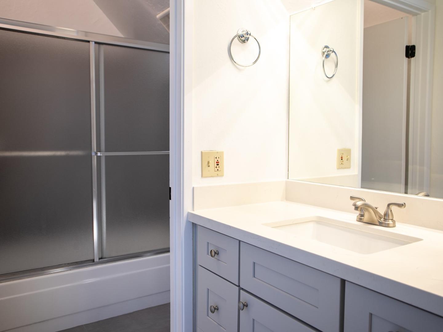 2536 West Middlefield Road Mountain View, CA 94043 - Photo 15 of 16 a bathroom with a shower sink and mirror