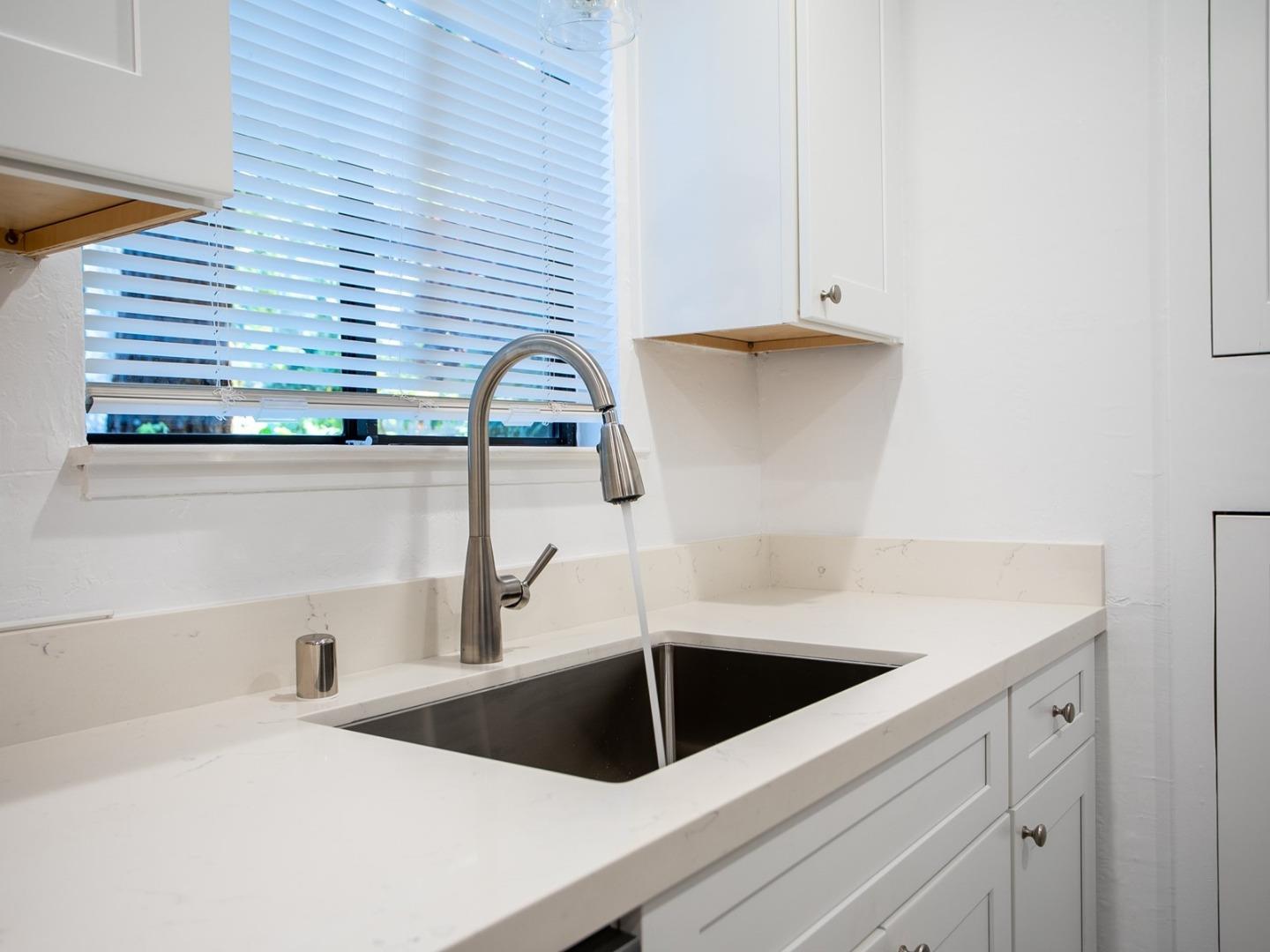 2536 West Middlefield Road Mountain View, CA 94043 - Photo 10 of 16 a kitchen with a sink and cabinets
