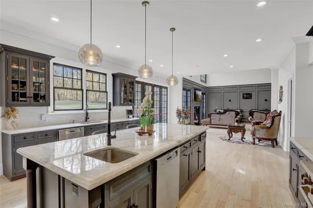 a living room with furniture large window and a flat screen tv