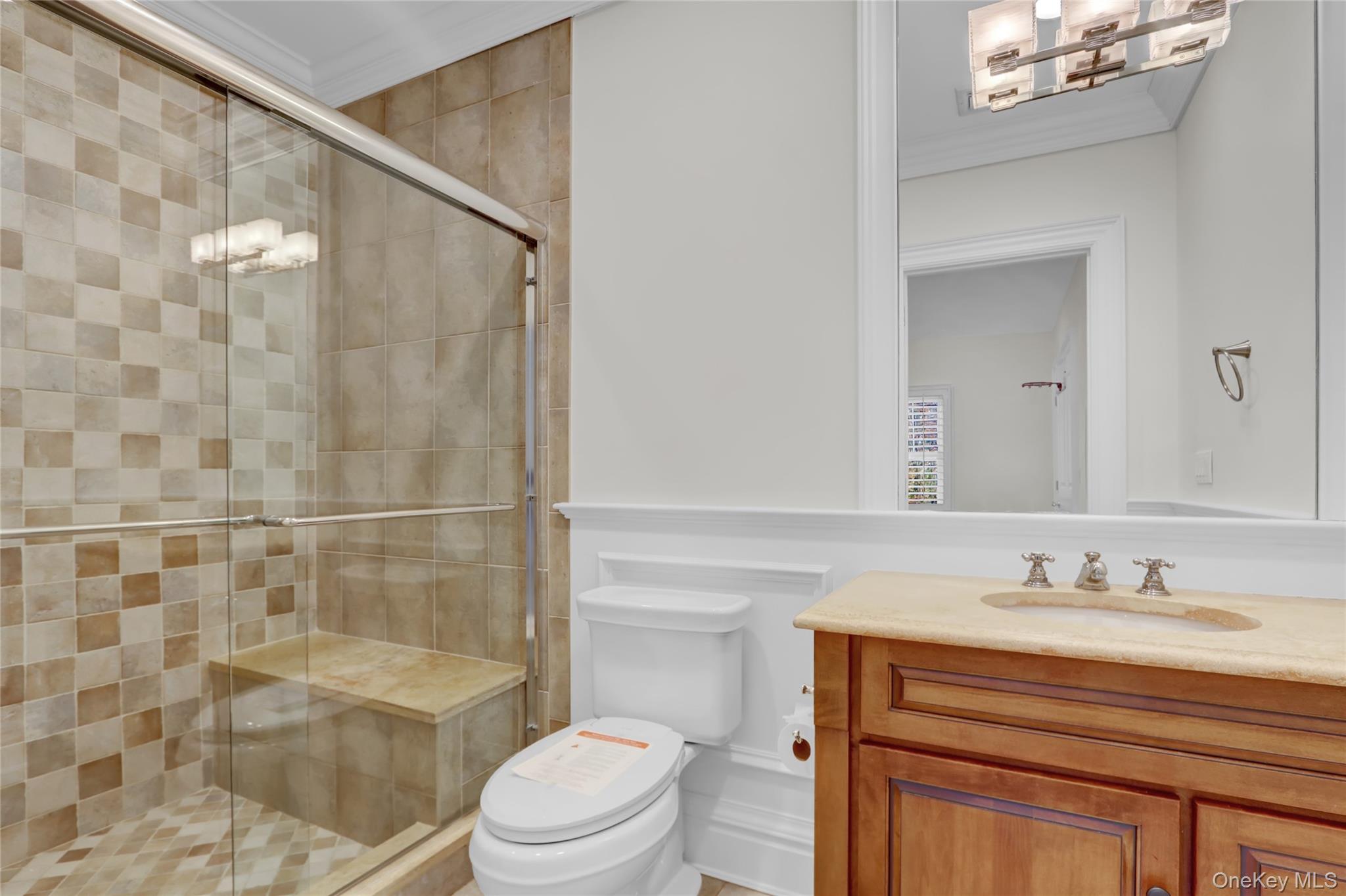119 Wheatley Road Old Westbury, NY 11568 - Photo 27 of 45 a bathroom with a sink a toilet and shower