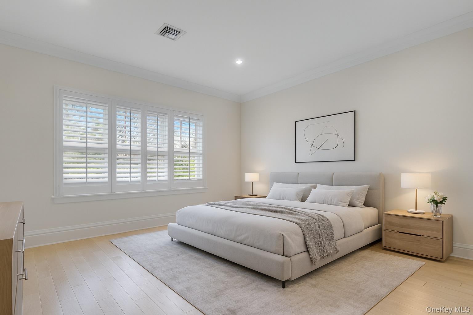 119 Wheatley Road Old Westbury, NY 11568 - Photo 30 of 45 a bedroom with a bed and a large window