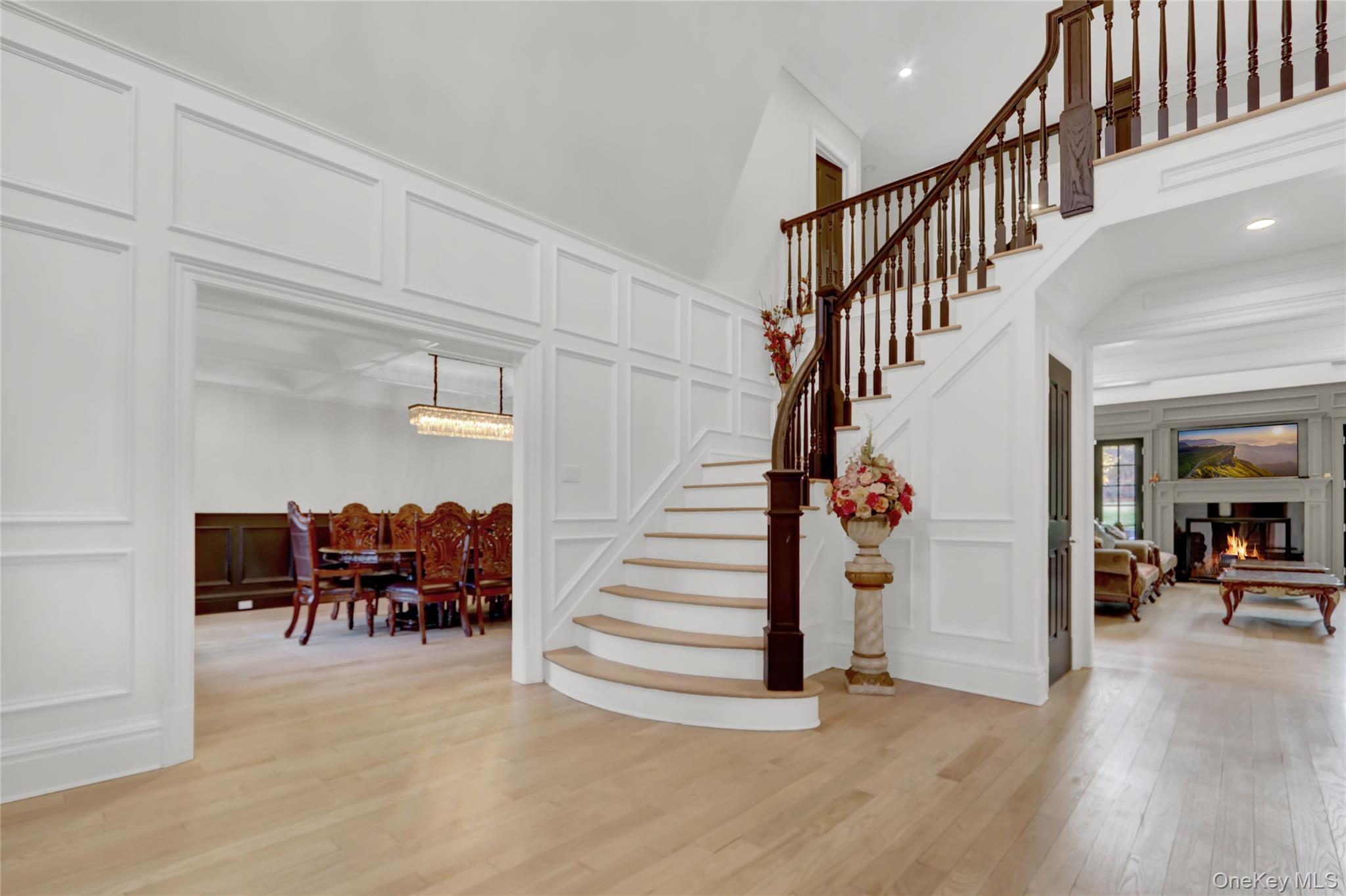 119 Wheatley Road Old Westbury, NY 11568 - Photo 3 of 45 a view of entryway and hall with wooden floor