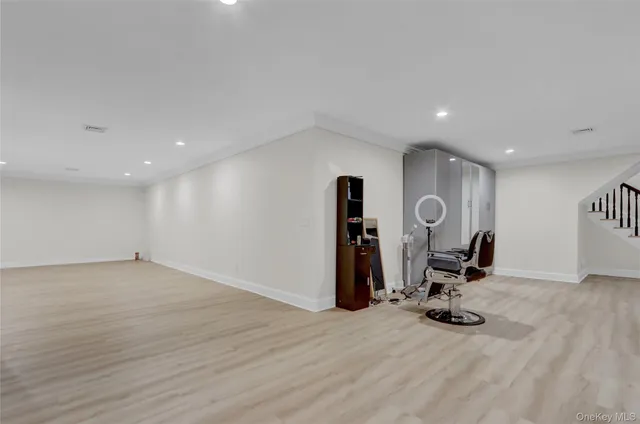 a view of a house with a big yard and large trees