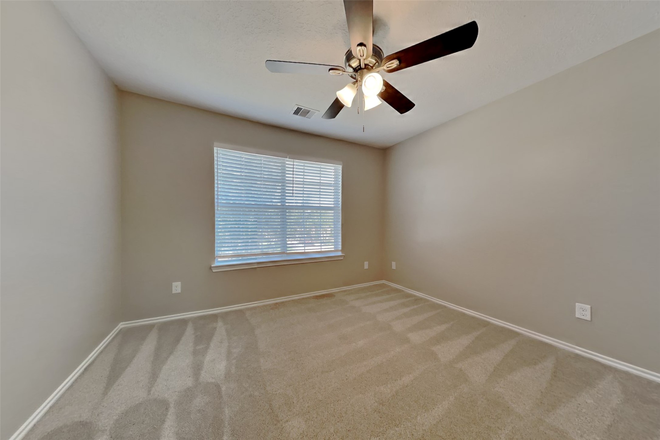 3502 Avalon Spring Lane Spring, TX 77386 - Photo 13 of 20 en empty room with windows and ceiling fan