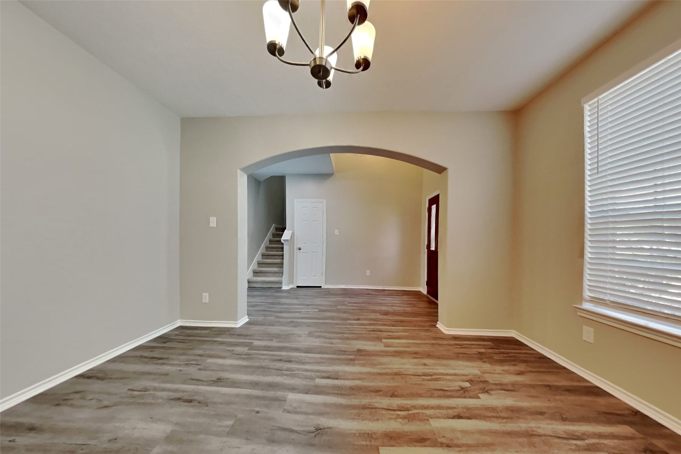 3502 Avalon Spring Lane Spring, TX 77386 - Photo 7 of 20 a view of a livingroom with wooden floor and a ceiling fan