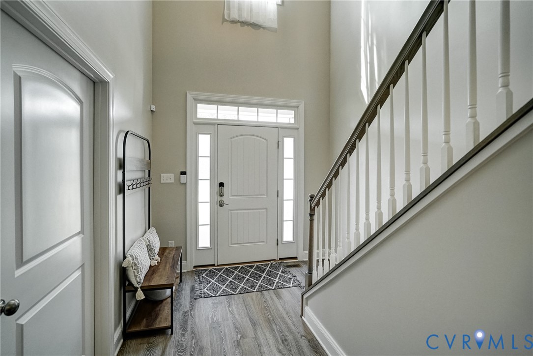 4669 Woburn Road Providence Forge, VA 23140 - Photo 38 of 78 a view of a hallway with wooden floor and staircase