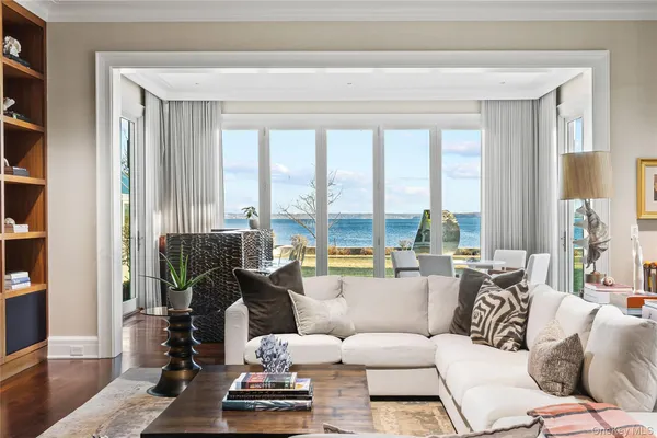 a living room with furniture and lamp