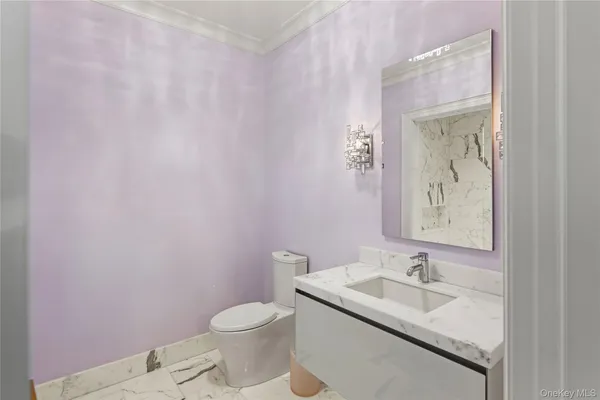 a bathroom with a shower a sink and a mirror