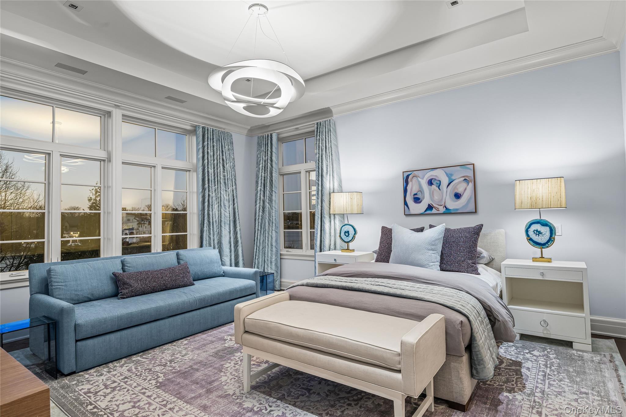 106 Premium Point New Rochelle, NY 10801 - Photo 29 of 44 Bedroom featuring a tray ceiling and wood finished floors