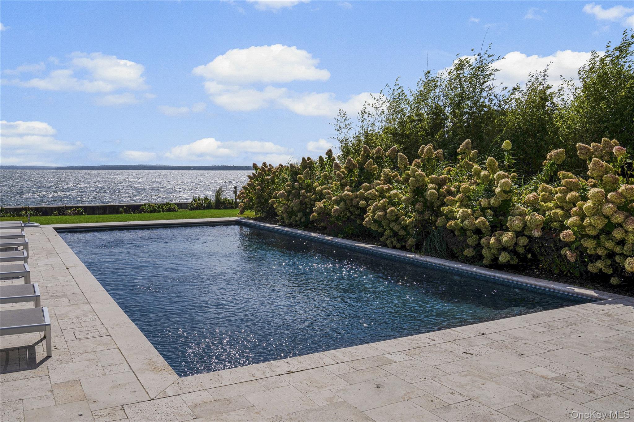 106 Premium Point New Rochelle, NY 10801 - Photo 38 of 44 Outdoor pool with a LI Sound water view and a patio