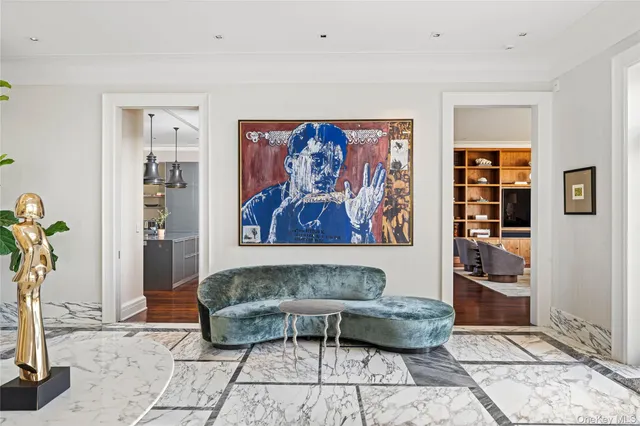 a living room with furniture and large windows