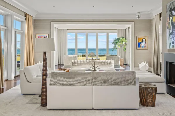 a living room with fireplace furniture and a fireplace