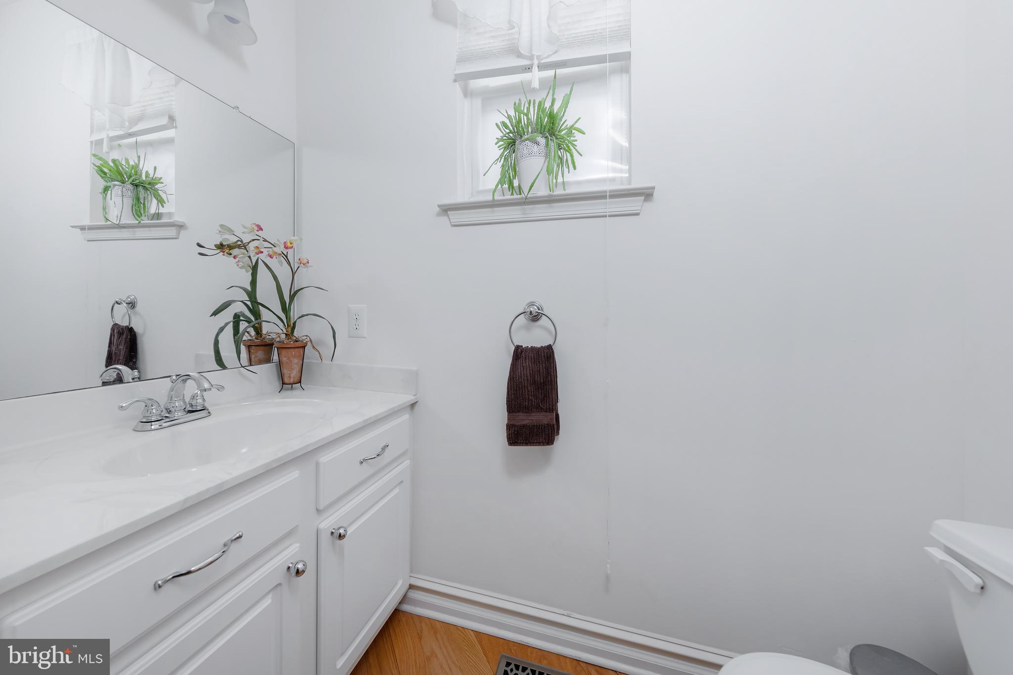 316 Pickwick Drive Williamstown, NJ 08094 - Photo 16 of 44 a bathroom with a sink a toilet and mirror
