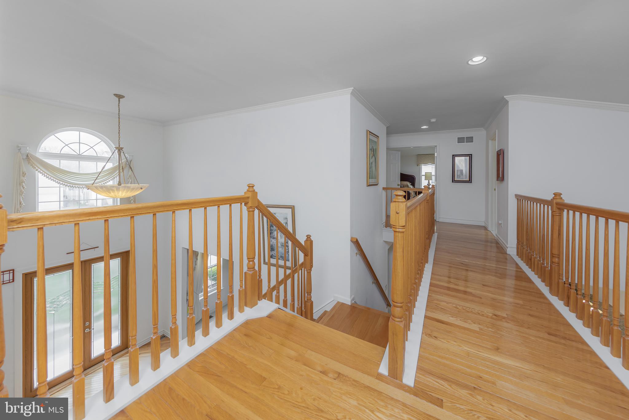 316 Pickwick Drive Williamstown, NJ 08094 - Photo 17 of 44 a view of a hallway with wooden floor and stairs