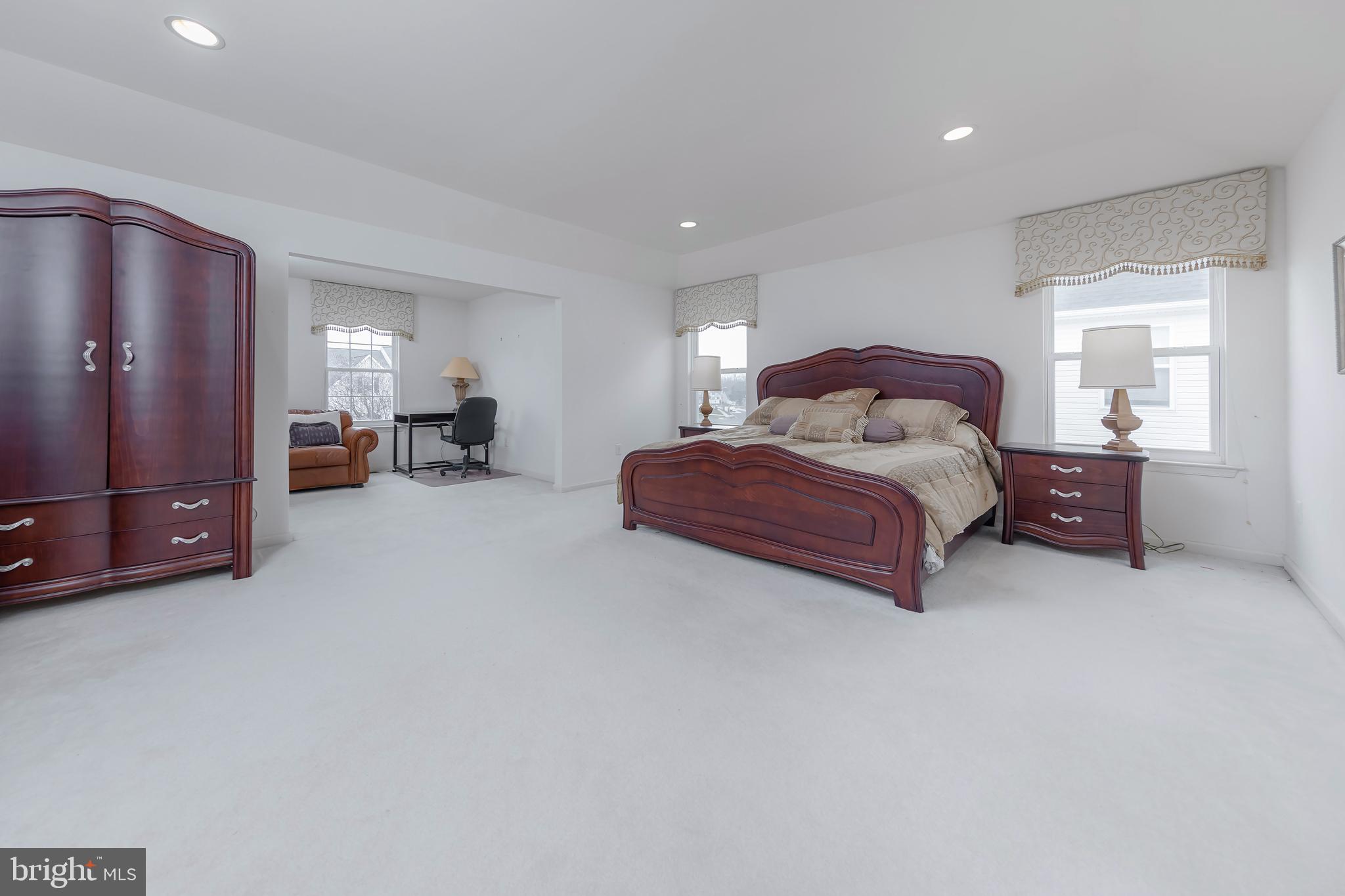 316 Pickwick Drive Williamstown, NJ 08094 - Photo 18 of 44 a spacious bedroom with a bed and a chair
