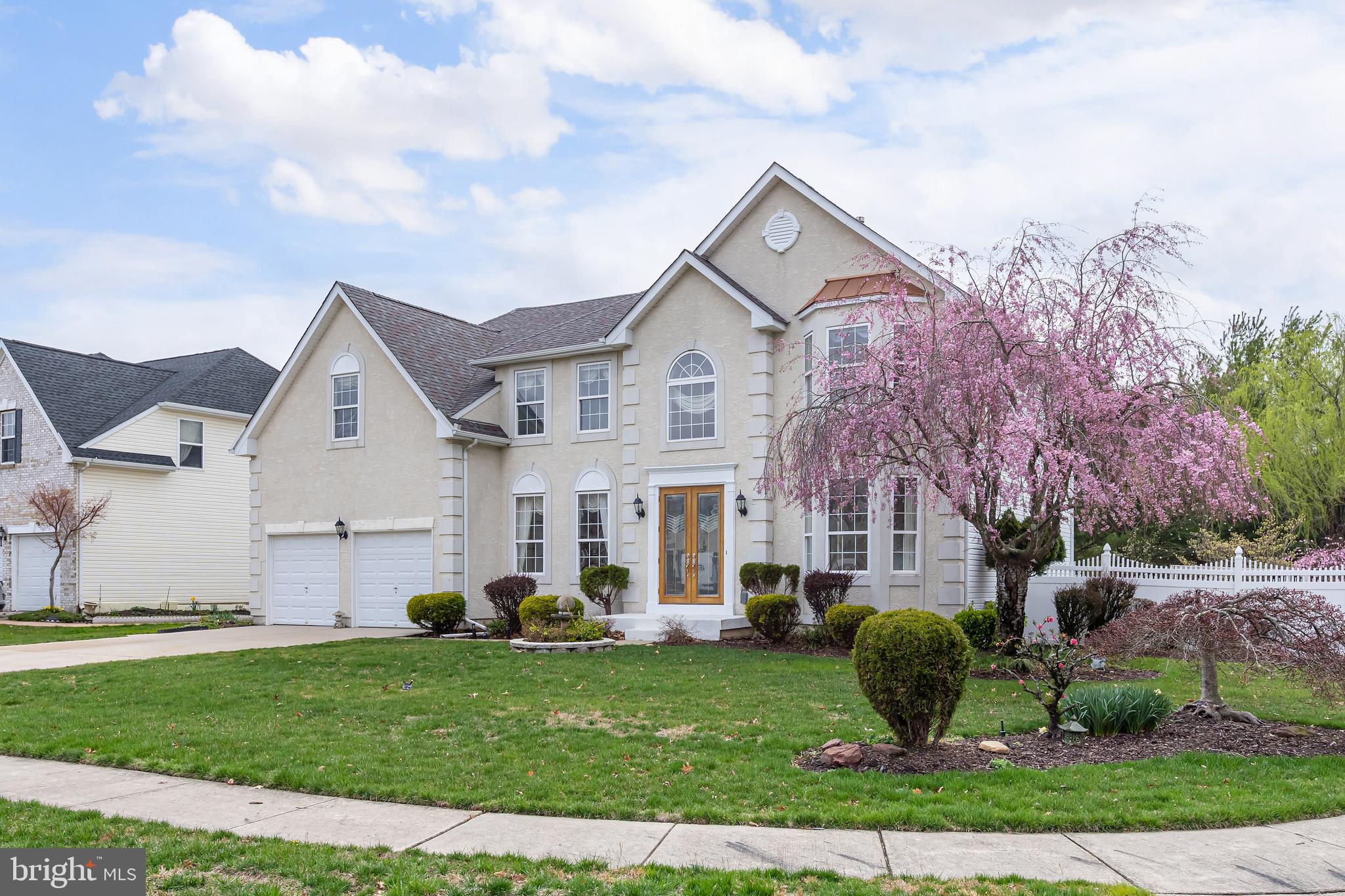 316 Pickwick Drive Williamstown, NJ 08094 - Photo 2 of 44 a front view of a house with a garden and plants