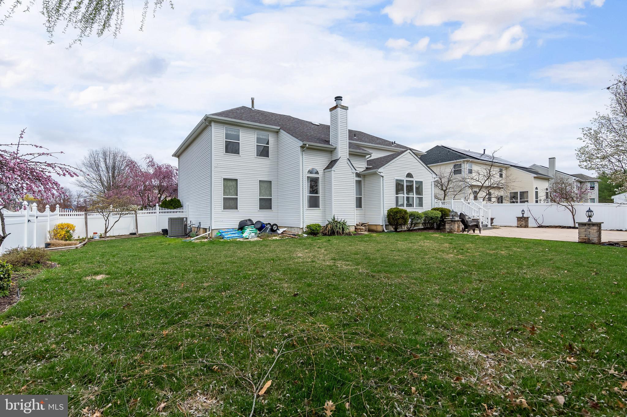 316 Pickwick Drive Williamstown, NJ 08094 - Photo 30 of 44 a view of a white house that has a big yard and more windows