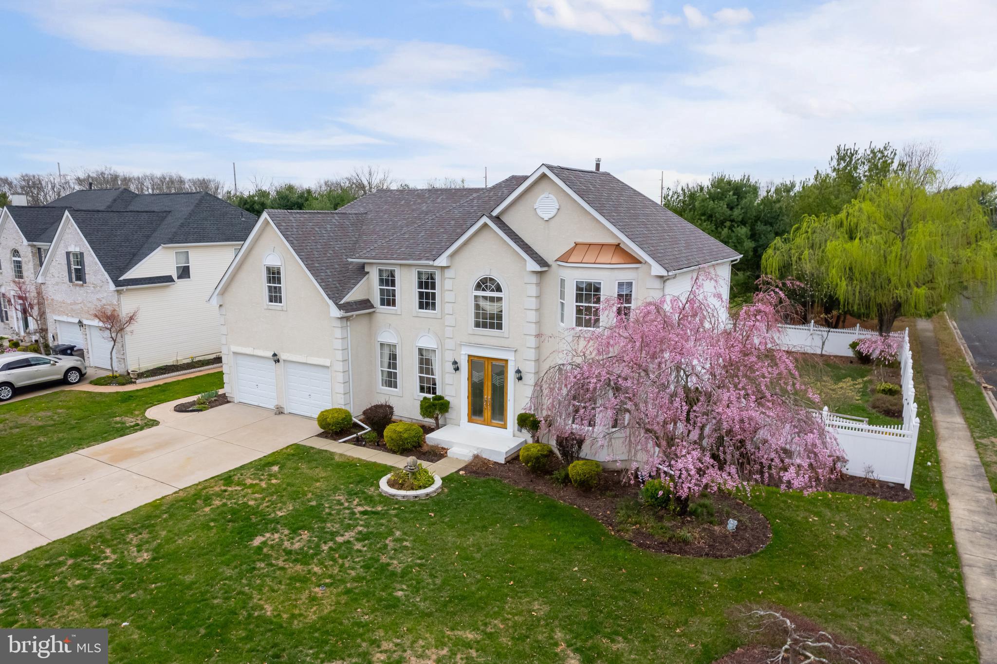 316 Pickwick Drive Williamstown, NJ 08094 - Photo 32 of 44 a front view of a house with a garden and plants