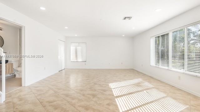 12838 Southwest 47th Street Miramar, FL 33027 - Photo 11 of 40 a view of an empty room with a window