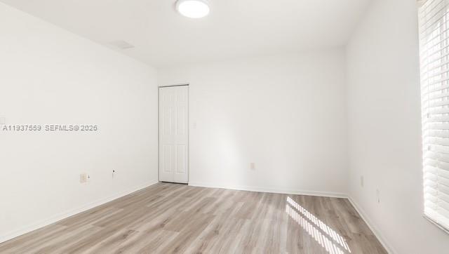 12838 Southwest 47th Street Miramar, FL 33027 - Photo 19 of 40 a view of an empty room and window