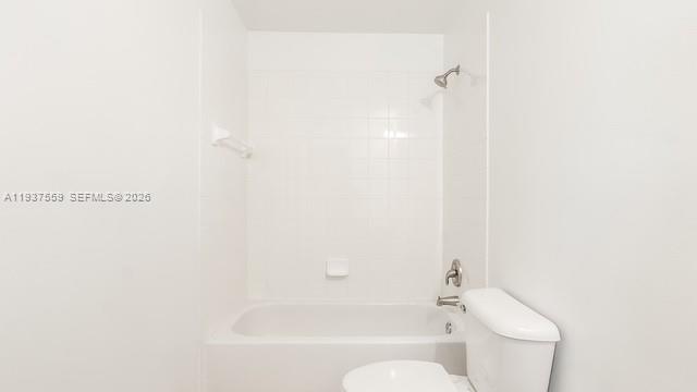 12838 Southwest 47th Street Miramar, FL 33027 - Photo 25 of 40 a white bath tub sitting next to a white toilet
