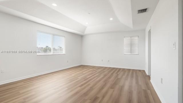 12838 Southwest 47th Street Miramar, FL 33027 - Photo 35 of 40 an empty room with wooden floor and windows