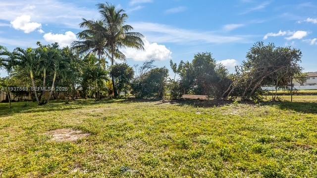 12838 Southwest 47th Street Miramar, FL 33027 - Photo 37 of 40 a view of swimming pool with a yard