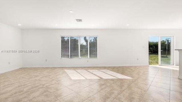 12838 Southwest 47th Street Miramar, FL 33027 - Photo 8 of 40 an empty room with windows