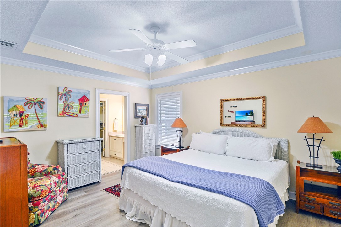 162 Toluca Lane St. Simons Island, GA 31522 - Photo 13 of 26 Primary bedroom with tray ceiling