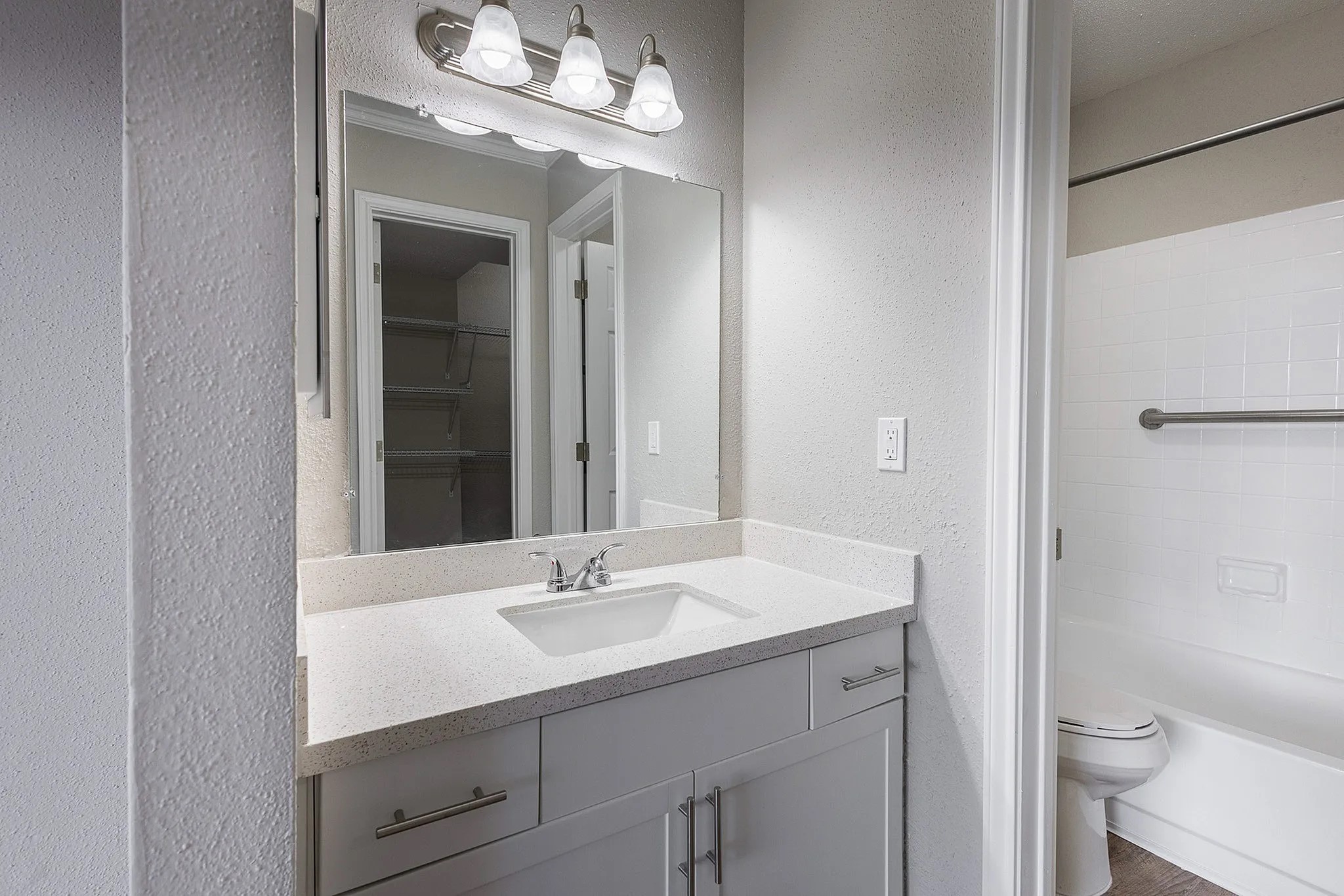 1230 Farm To Market 1960 Bypass Road East, Unit 723 Humble, TX 77338 - Photo 1 of 20 a bathroom with a sink a toilet and a mirror