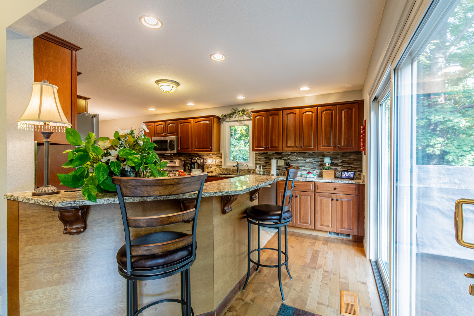 2555 Ridgefield Road Princeton, IL 61356 - Photo 13 of 50 a kitchen with a refrigerator and a dining table