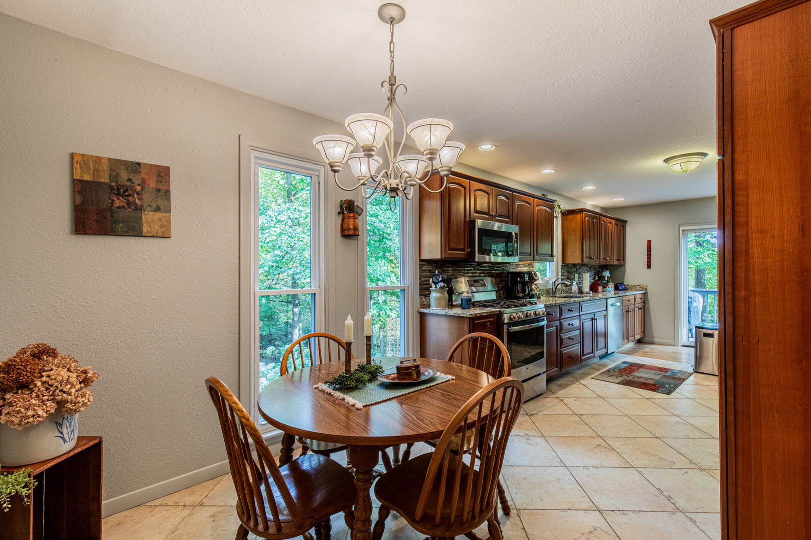 2555 Ridgefield Road Princeton, IL 61356 - Photo 18 of 50 a view of a dining room with furniture and a chandelier