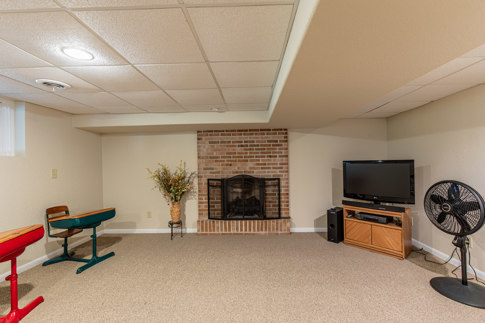 2555 Ridgefield Road Princeton, IL 61356 - Photo 32 of 50 a living room with furniture a flat screen tv and a fireplace