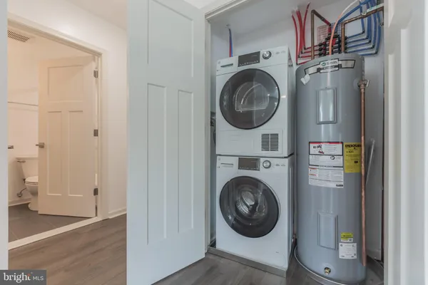 a view of a hallway with washer and dryer