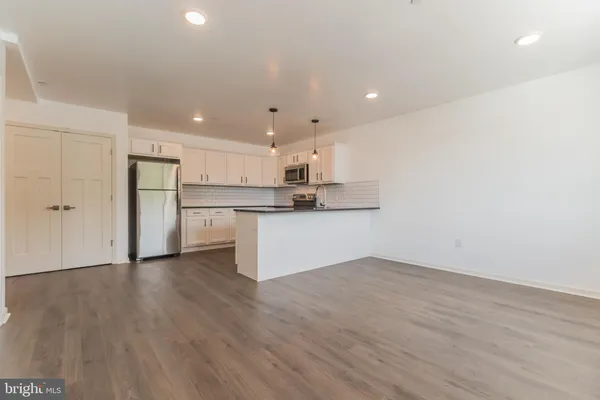 a view of kitchen with wooden floor