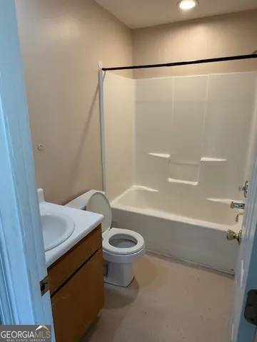 a bathroom with a shower and a toilet