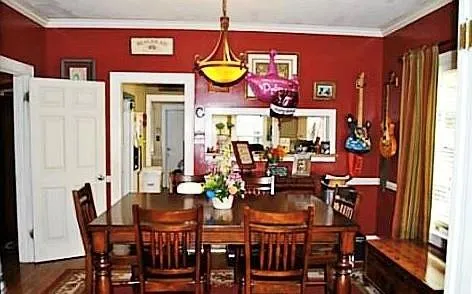 a view of a dining room with furniture and chandelier